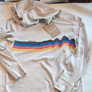 Patagonia Cream Hoodie with Vibrant Stripe Design